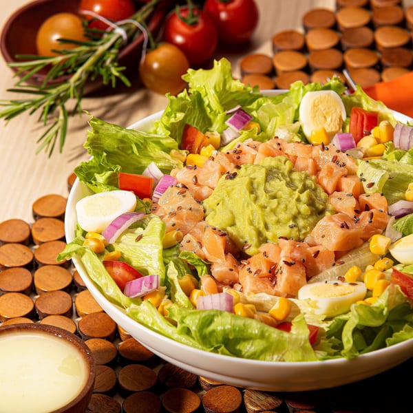 Mike's Pizza Deli Station's salmon salad with avocado, corn, red onion, and hard-boiled eggs.